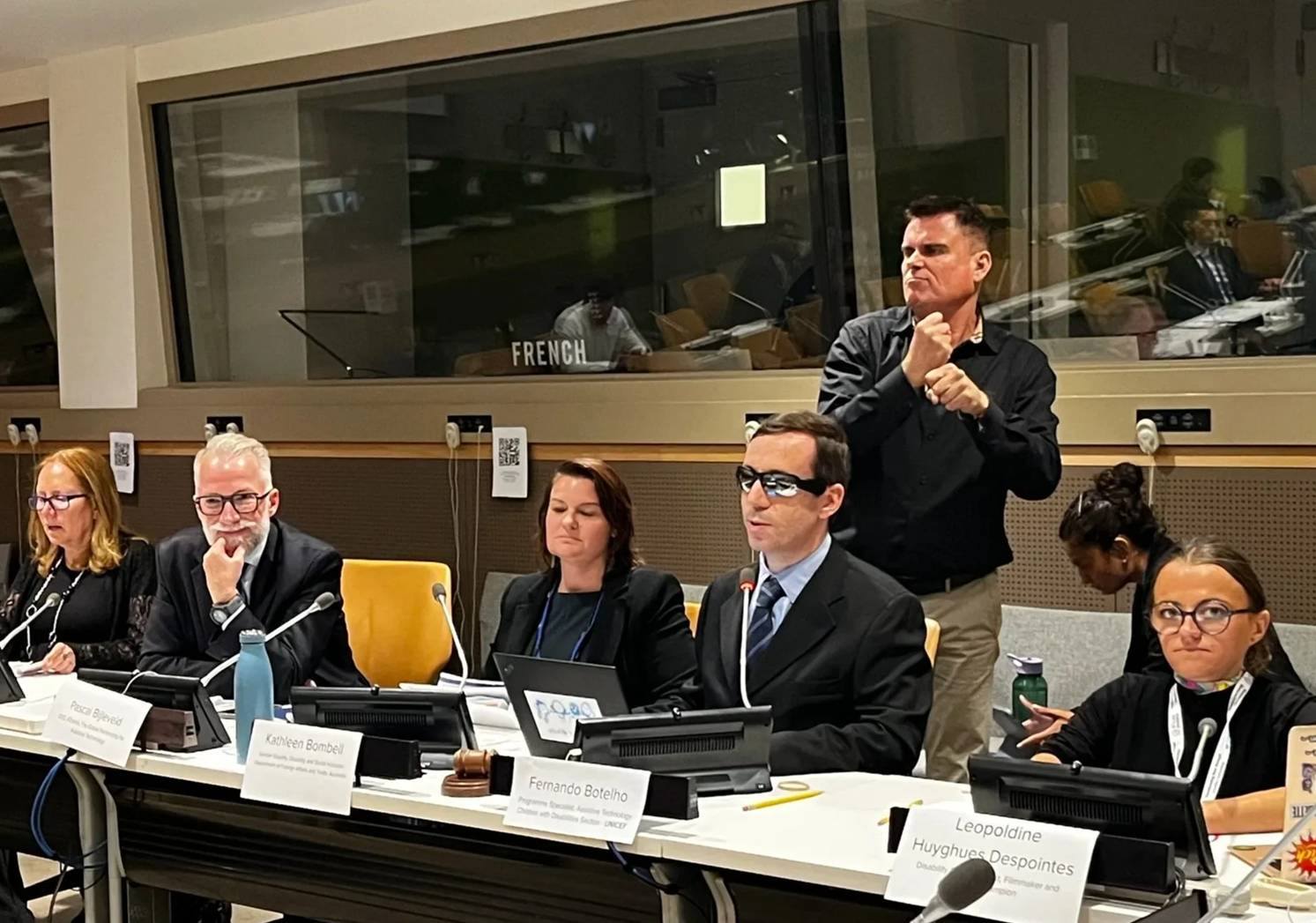 Panel discussion at COSP 18 side event on Assistive Technology and Employment. (From left) Sara Basson, Pascal Bijleveld, Kathleen Bombell, Fernando Botelho, and ATscale champion, Leopoldine Huyghues Despointes, with a sign language interpreter standing behind.