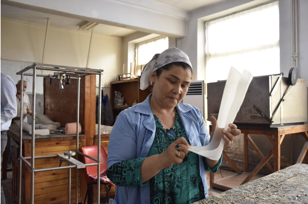 A worker at the National Orthopaedic Centre (NOC), Dushanbe, fabricating locally manufactured mobility products. The ATscale-supported programme has been supporting NOC to refresh their strategy and implementation plan. Photo: WHO Tajikistan.