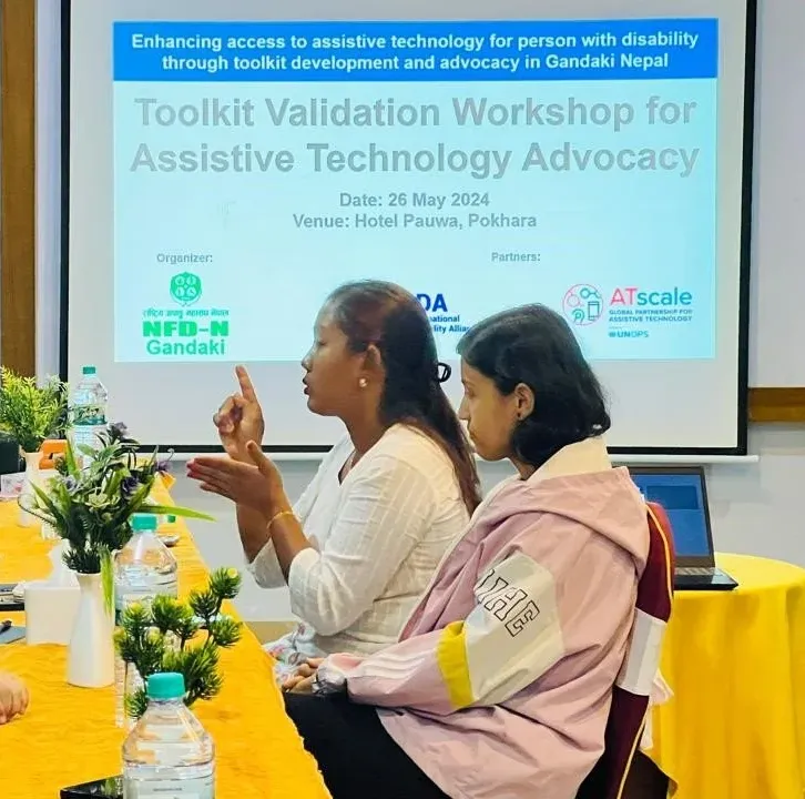 A participant with a visual impairment reviewing the draft toolkit in Braille