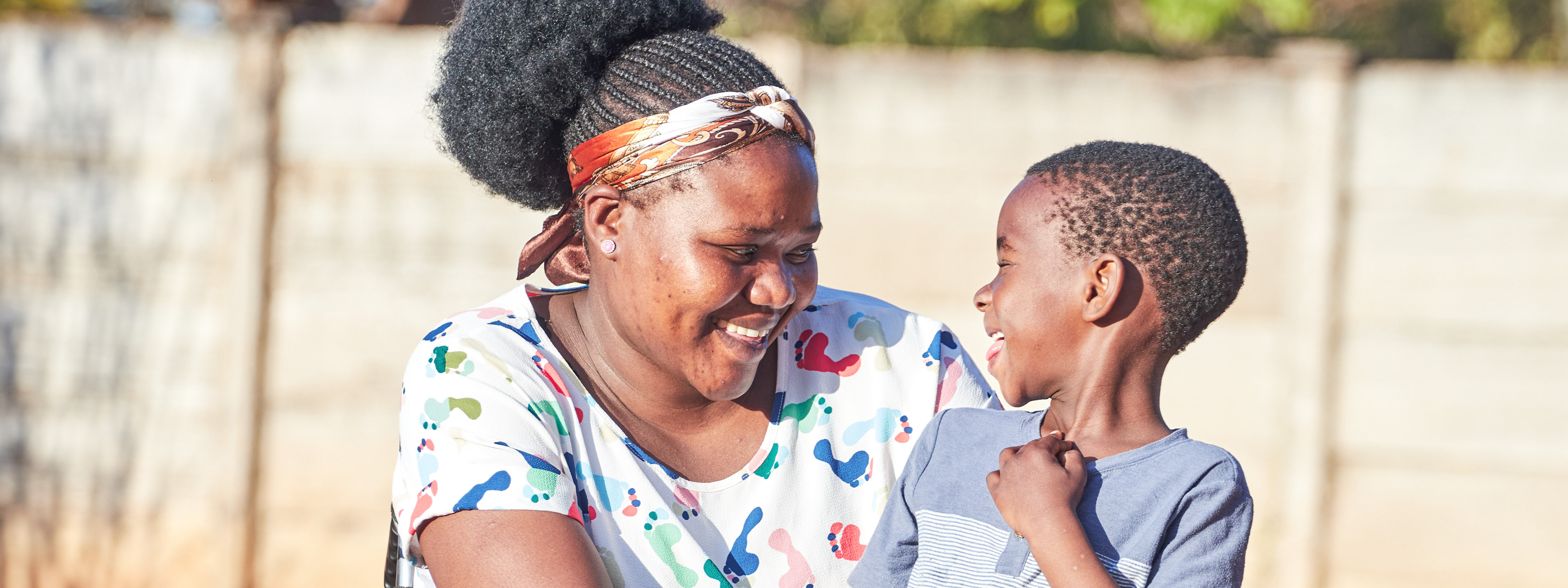 Hope with her son. Hope is a primary school teacher in Bulawayo. She received a wheelchair through our partner Lorewo via our CLASP project.